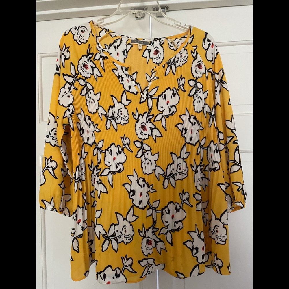 NWOT Bright yellow and black blouse. Never worn.